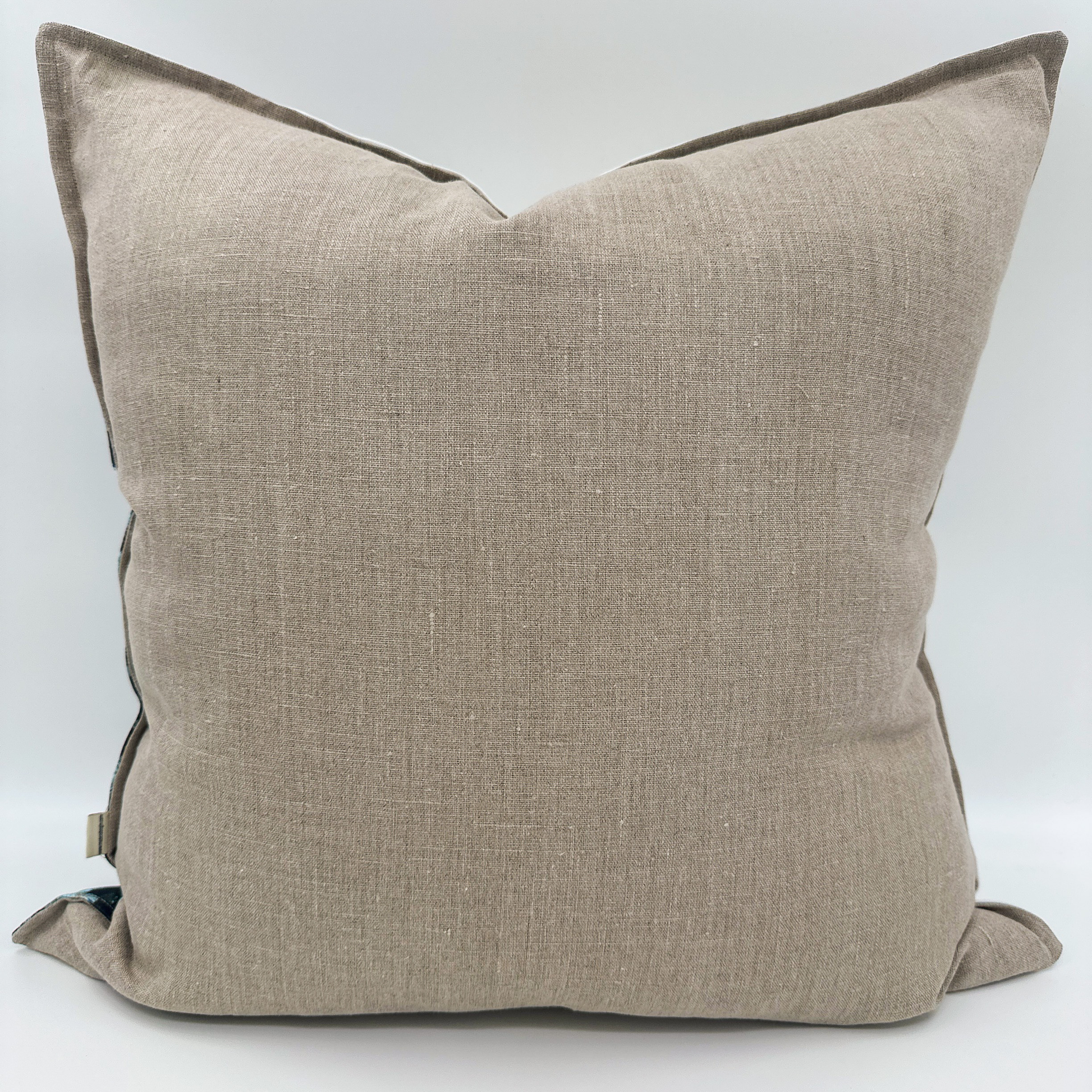 Back view of Aspen Grove pillow featuring solid natural linen fabric.