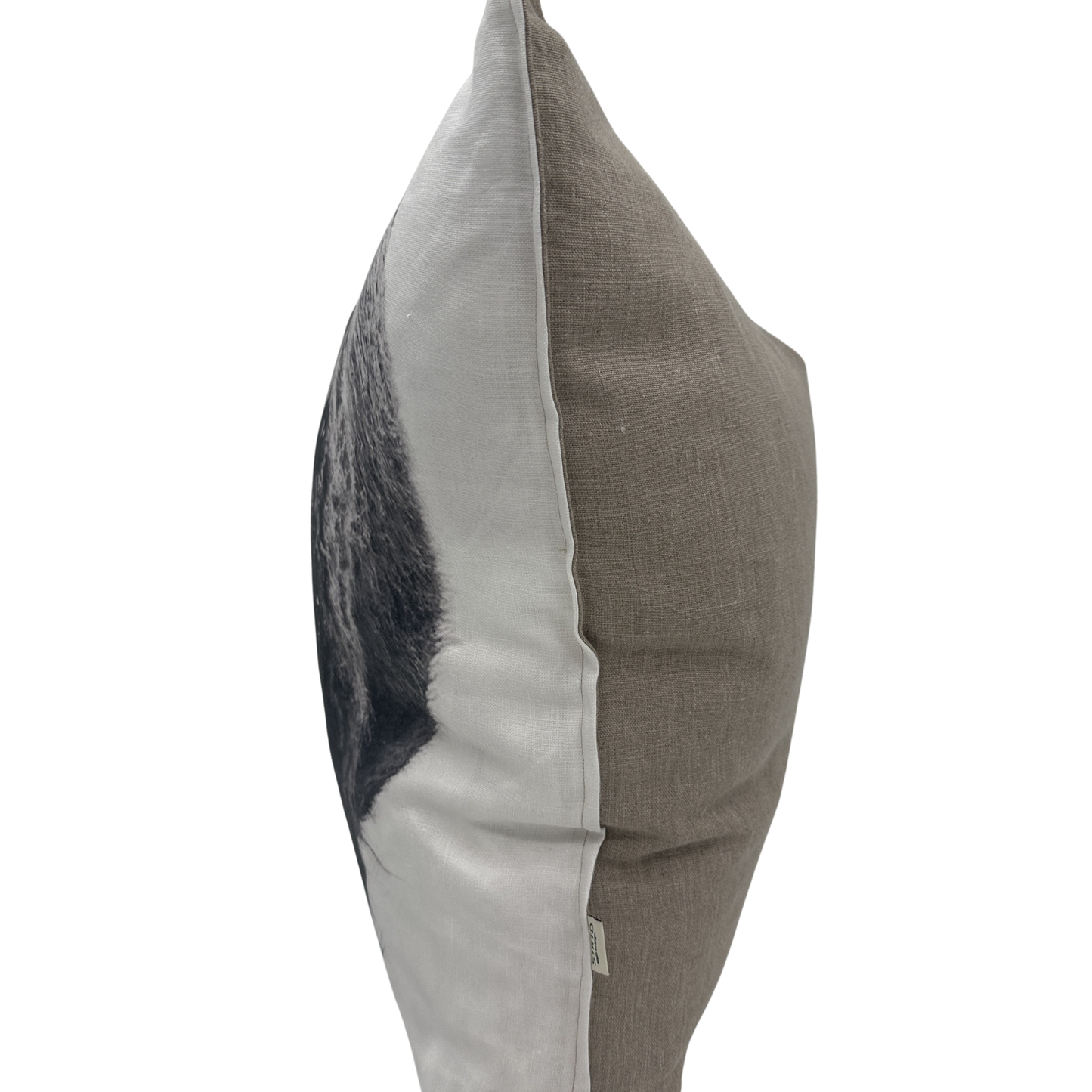 Side view — Bison pillow showing the printed wildlife front and natural linen back