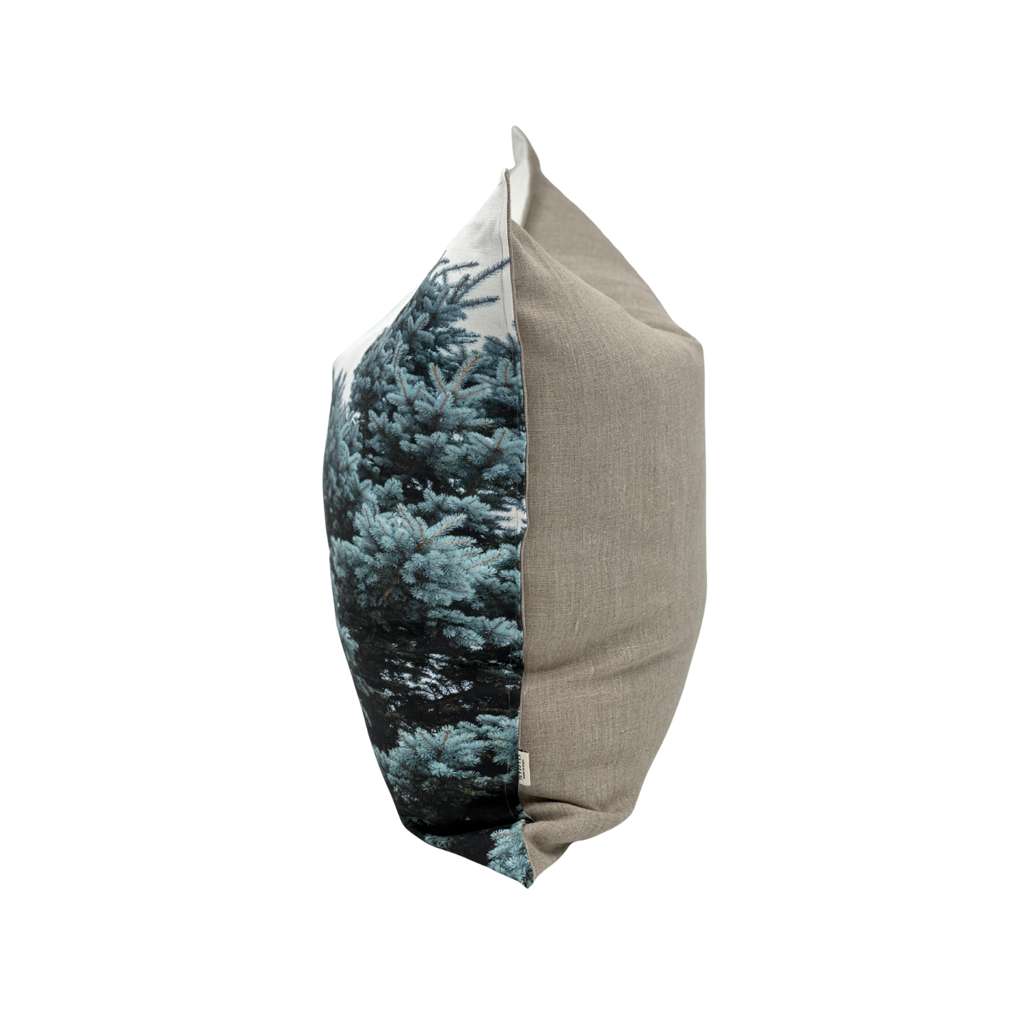 Side view of Blue Spruce pillow — Utah evergreen branches and natural linen back
