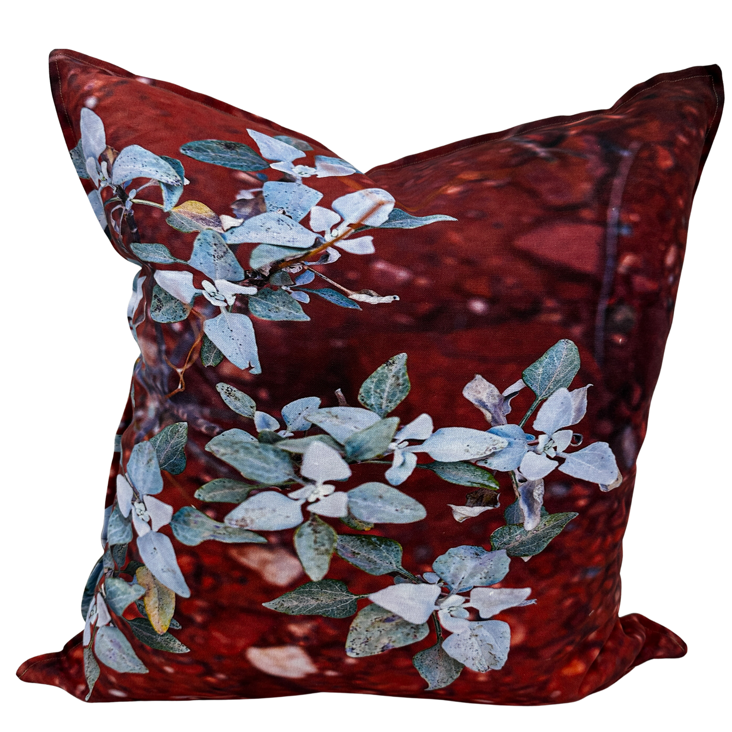 Saltwing pillow — close-up of Fourwing Saltbush leaves against warm red Utah desert tones on natural linen texture